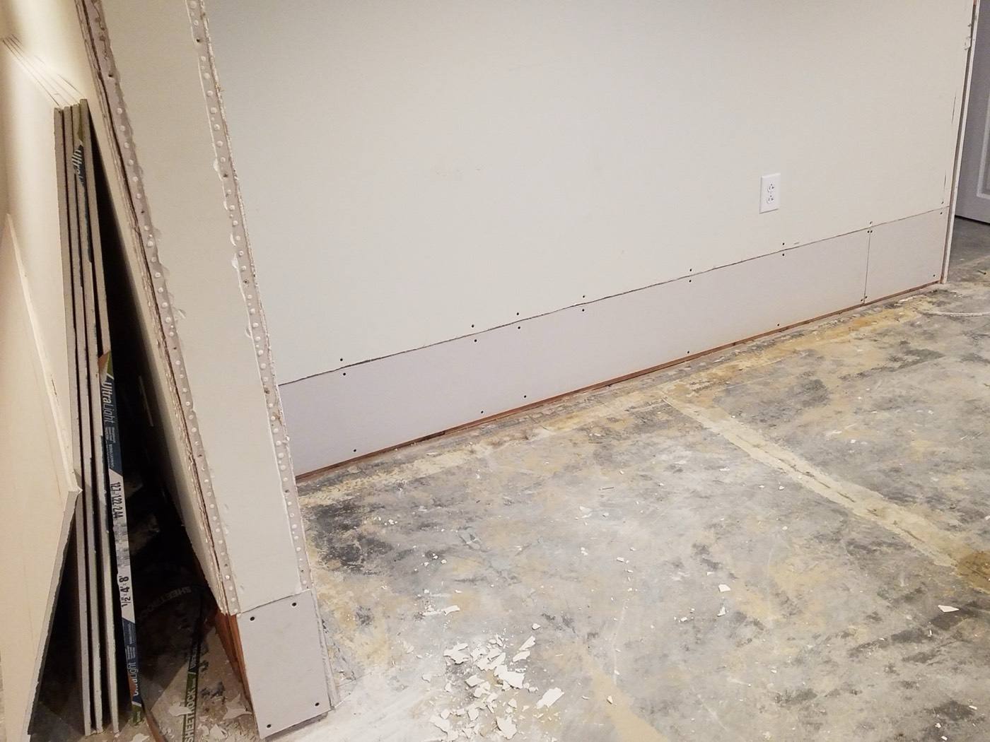Contractor referral program job: new lower drywall panels installed after a leak repair