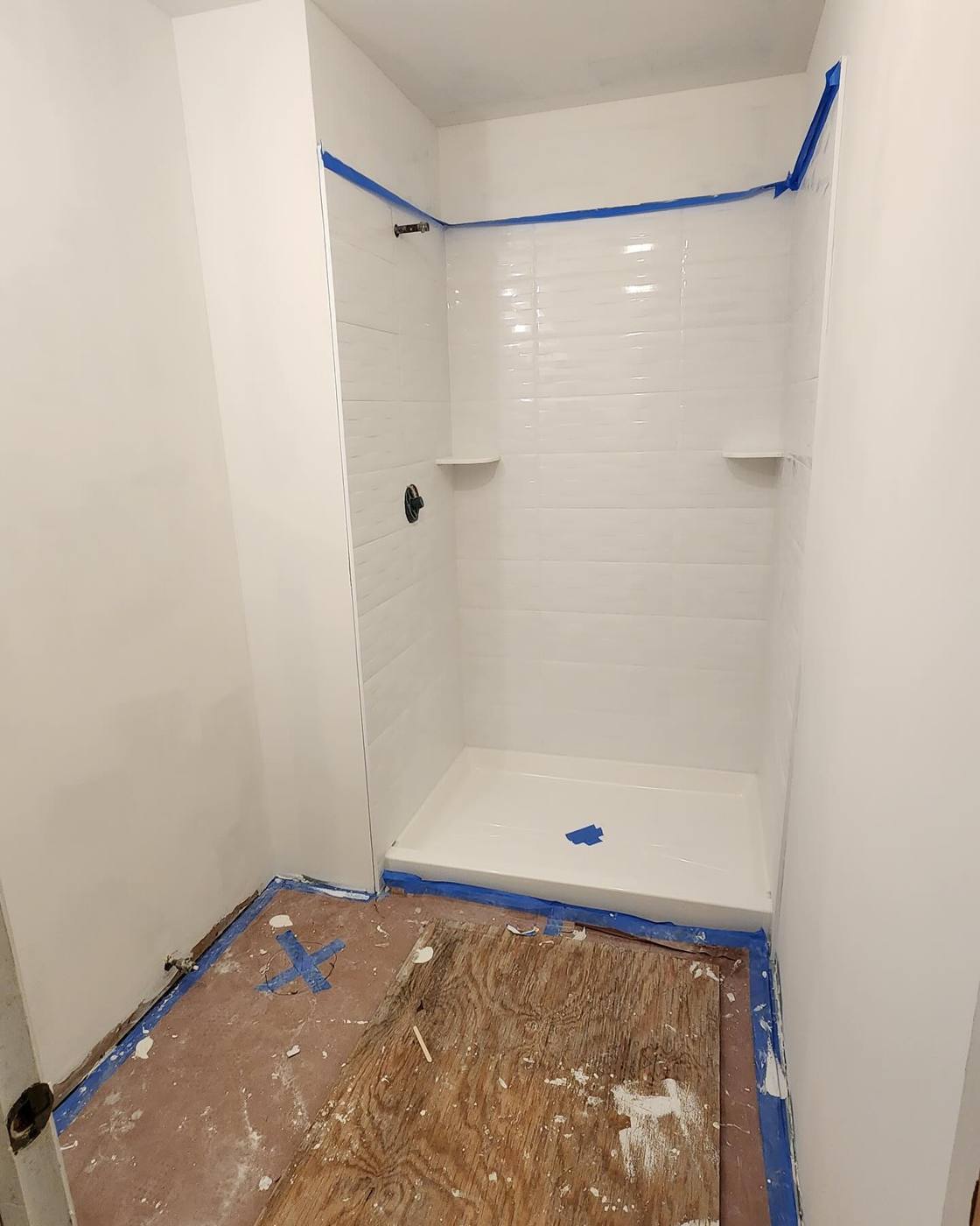 Shower pan and drain installed during a bathroom remodel