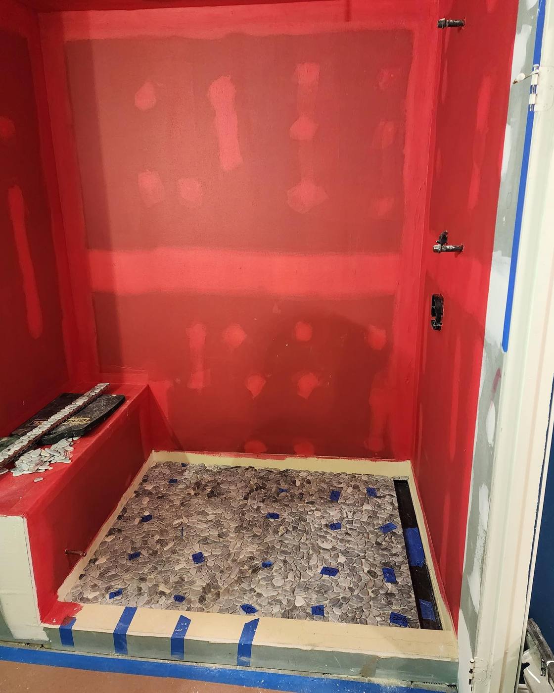 Shower walls and bench coated in waterproofing membrane