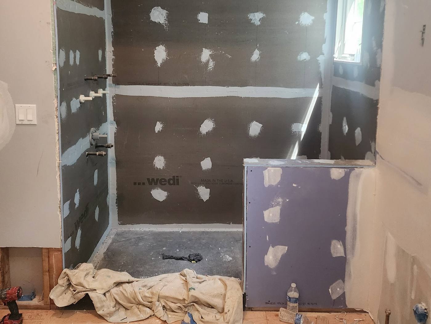 Shower alcove and bench waterproofed before tile