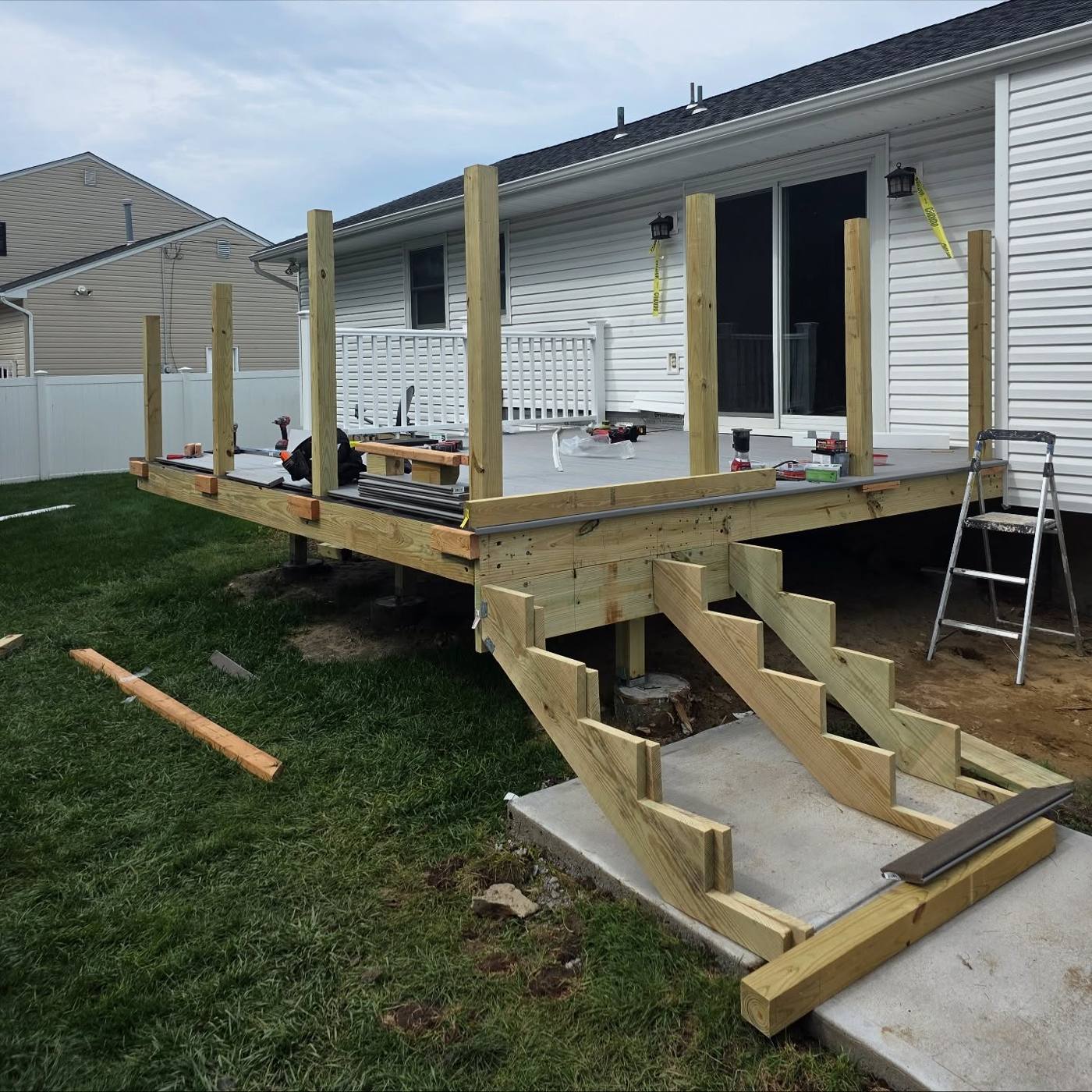 Pressure-treated deck framing going in