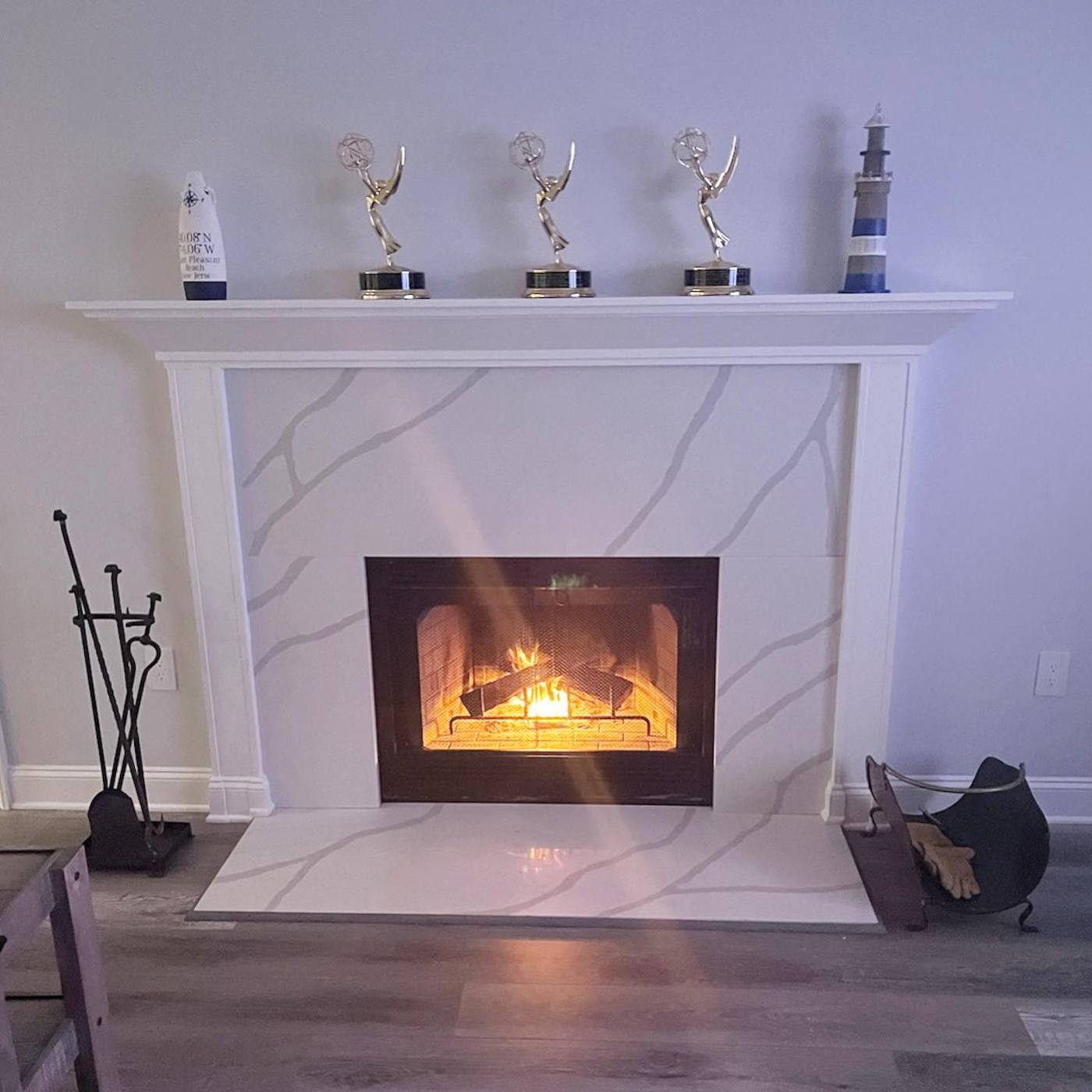 Finished quartz fireplace surround with white mantel