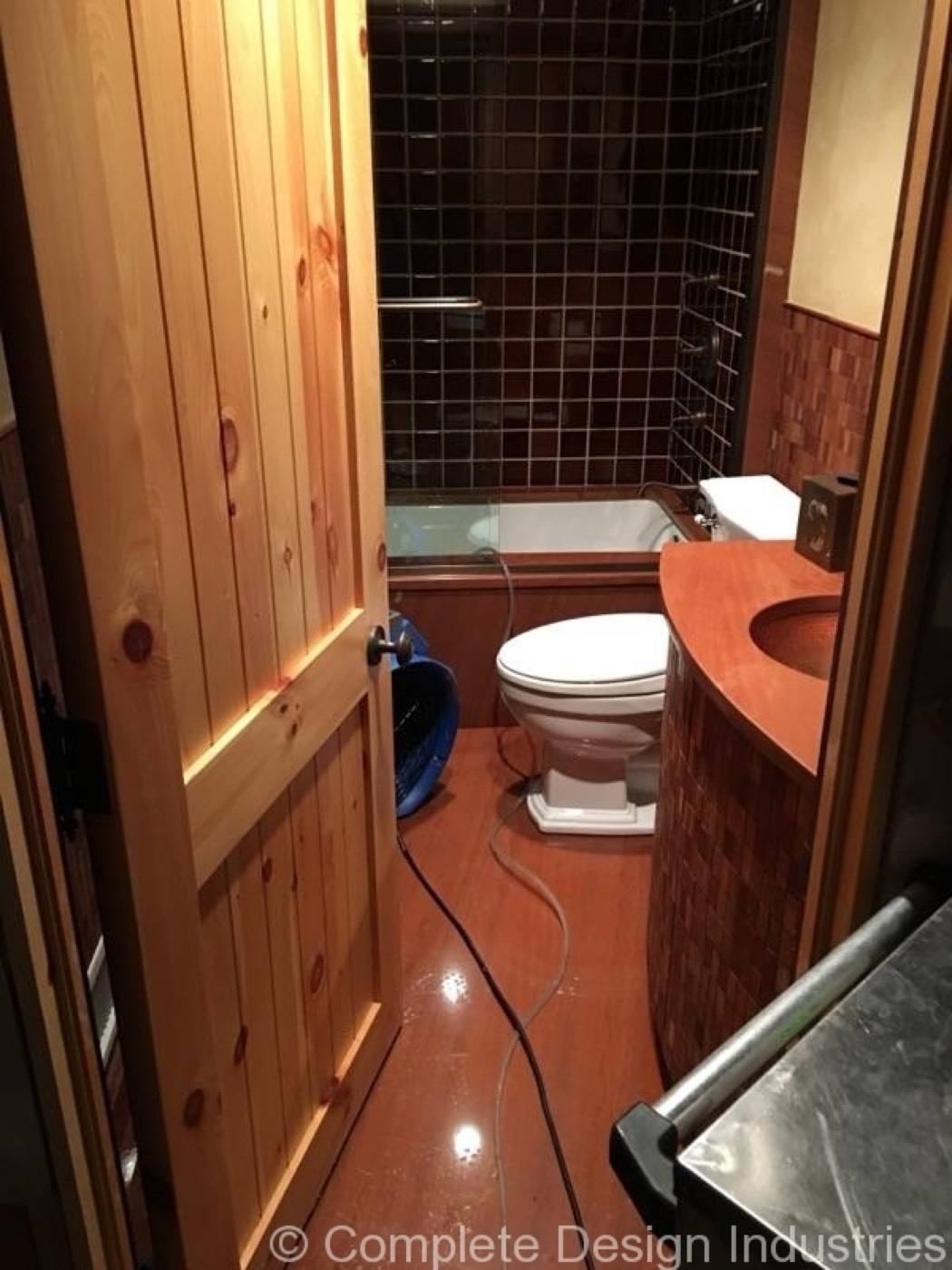 Bathroom floor during sewer backup cleanup