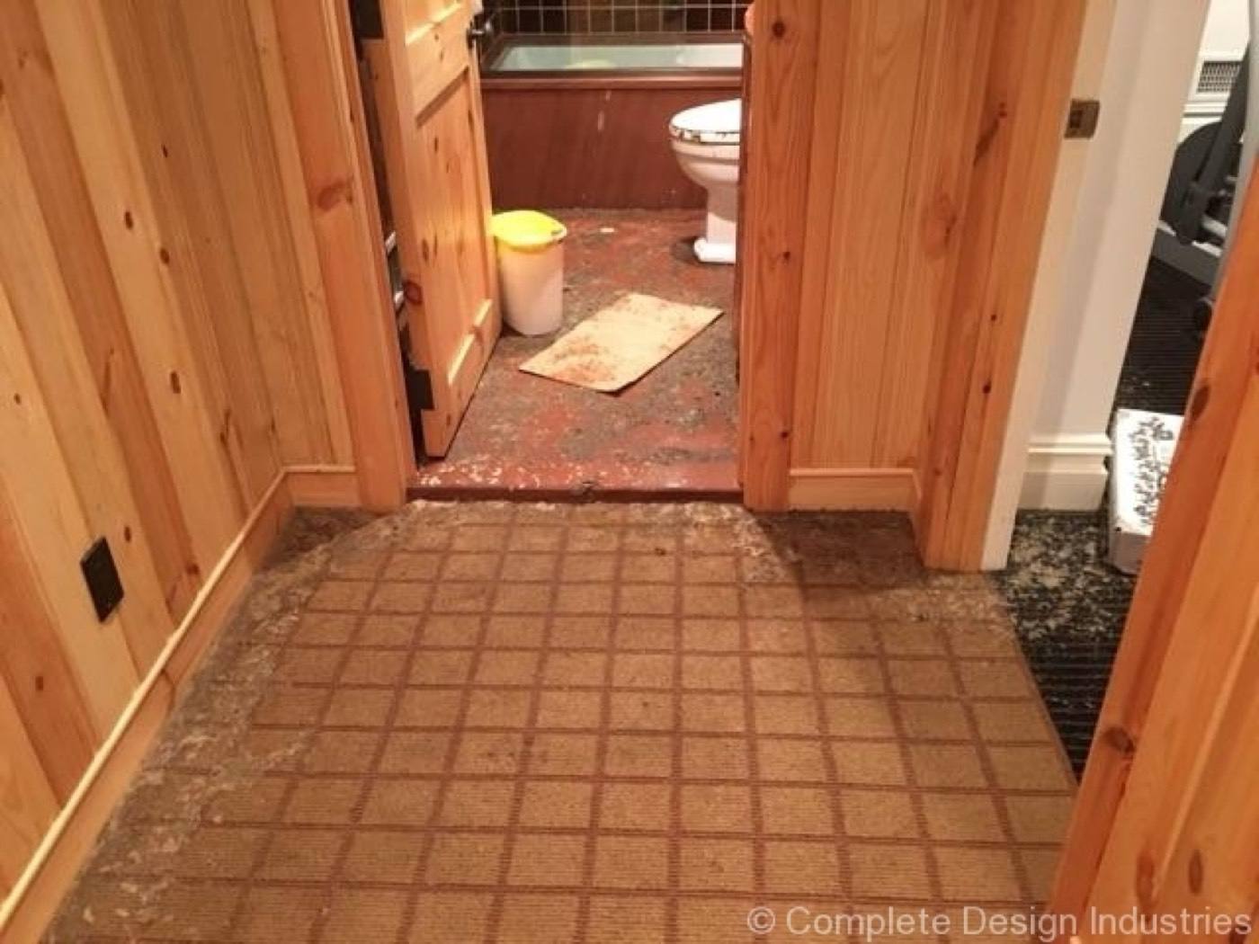 Sewage cleanup NJ job in a hallway affected by a sewer backup